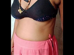 Bhabhi is showing her big breasts while wearing a bra